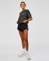 Woman wearing Values Run Club FLXCotton Tee - Dark Storm-Alloy | Model:Georgia | Size:XS