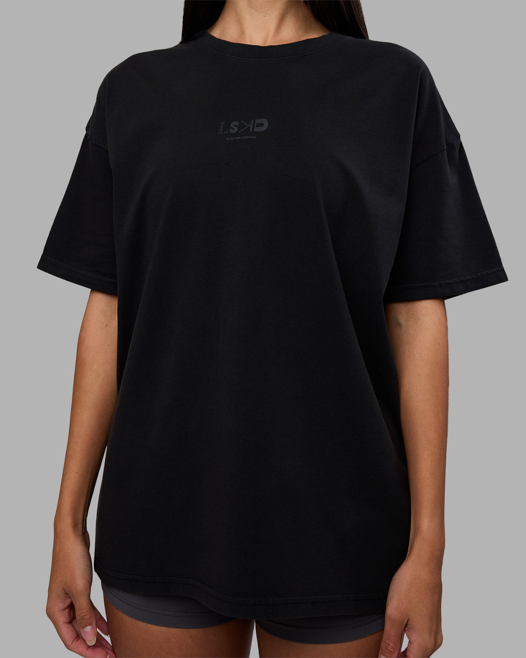 Woman wearing Variation Heavyweight FLXCotton Oversized Tee - Black-Black | Model:Rhiley | Size:XS