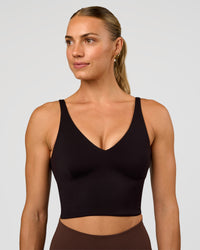 Woman wearing Vitality Long Line Sports Bra - Black | Model:Maja | Size:XS