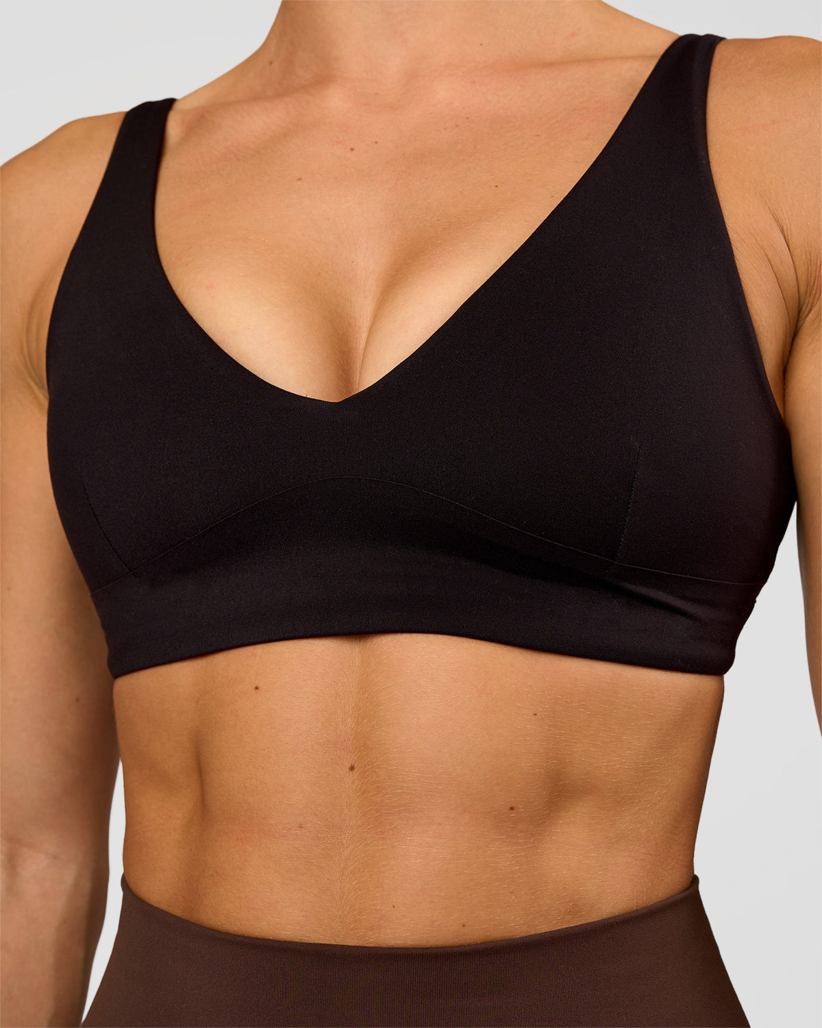 Woman wearing Vitality Sports Bra - Black | Model:Maja | Size:XS