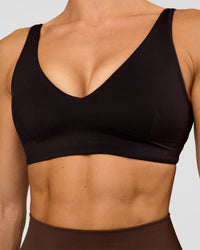 Woman wearing Vitality Sports Bra - Black | Model:Maja | Size:XS