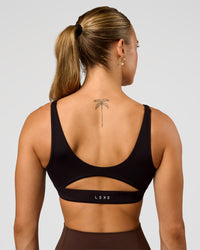 Woman wearing Vitality Sports Bra - Black | Model:Maja | Size:XS