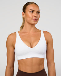Woman wearing Vitality Sports Bra - White | Model:Maja | Size:XS | Thumbnail Index: 1
