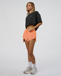 Woman wearing We Love This  FLXCotton Oversized Tee - Black Washed-White | Model:Leilani | Size:XS
