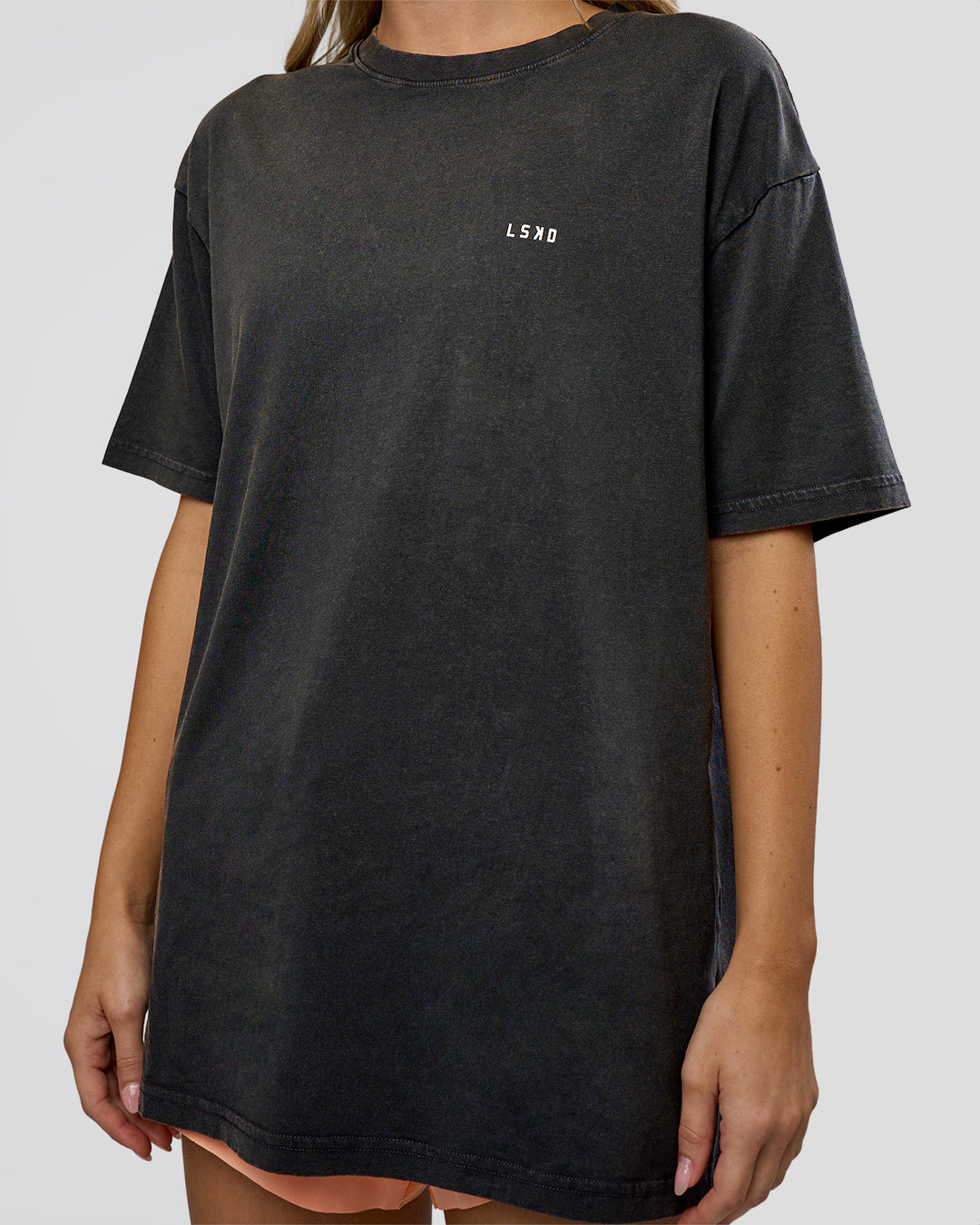 Woman wearing We Love This  FLXCotton Oversized Tee - Black Washed-White | Model:Leilani | Size:XS