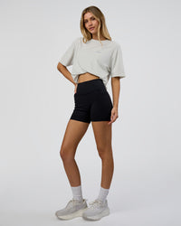 Woman wearing We Love This  FLXCotton Oversized Tee - Digital Mist Washed-Electric Indigo | Model:Leilani | Size:XS