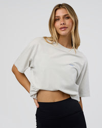Woman wearing We Love This  FLXCotton Oversized Tee - Digital Mist Washed-Electric Indigo | Model:Leilani | Size:XS