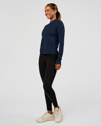 Woman wearing AeroFLX+ Long Sleeve Half Zip - Future Navy/Future Navy | Model:Charli | Size:XS