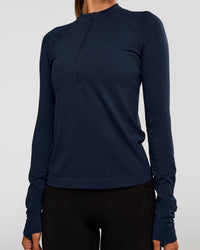 Woman wearing AeroFLX+ Long Sleeve Half Zip - Future Navy/Future Navy | Model:Charli | Size:XS