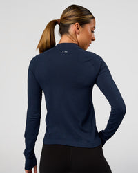 Woman wearing AeroFLX+ Long Sleeve Half Zip - Future Navy/Future Navy | Model:Charli | Size:XS