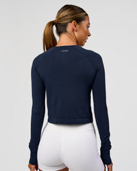 Woman wearing AeroFLX+ Seamless Long Sleeve Skimmer Tee - Future Navy/Future Navy | Model:Charli | Size:XS