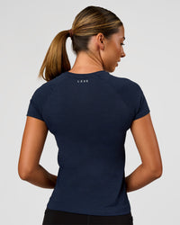 Woman wearing AeroFLX+ Seamless Tee - Future Navy/Future Navy | Model:Charli | Size:XS