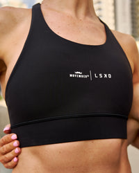 Campaign image of Movember x LSKD Accelerate Sports Bra - Black | Thumbnail Index: 1
