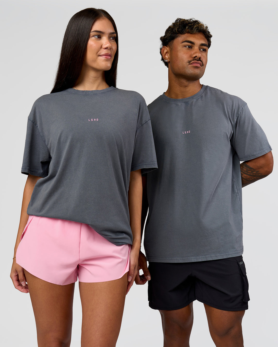 Duo wearing Built On Values FLXCotton Oversized Tee - Dark Storm Washed-Pink Rose | Model:Xav | Size:L | Model:Rhiley | Size:XS - view 6
