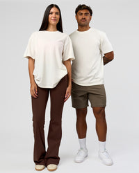 Duo wearing Built On Values FLXCotton Oversized Tee - Off White-Pink Rose | Model:Xav | Size:L | Model:Rhiley | Size:XS | Thumbnail Index: 7