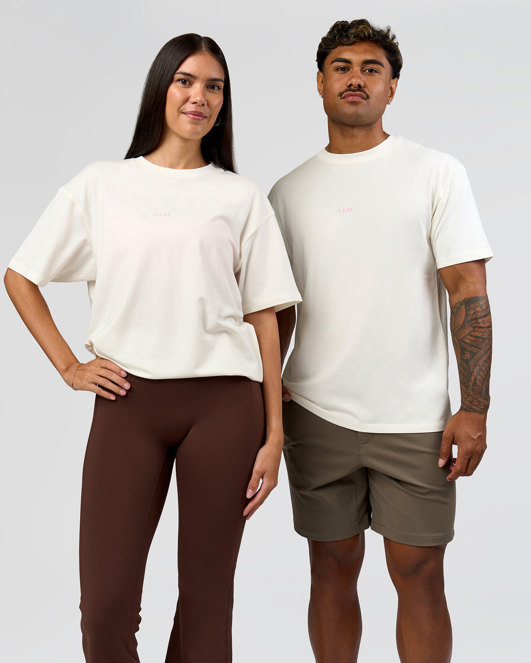 Duo wearing Built On Values FLXCotton Oversized Tee - Off White-Pink Rose | Model:Xav | Size:L | Model:Rhiley | Size:XS - view 11