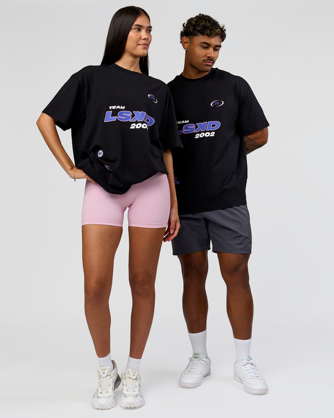 Duo wearing League Heavyweight FLXCotton Oversized Tee - Black-Power Cobalt | Model:Xav | Size:L | Model:Rhiley | Size:XS