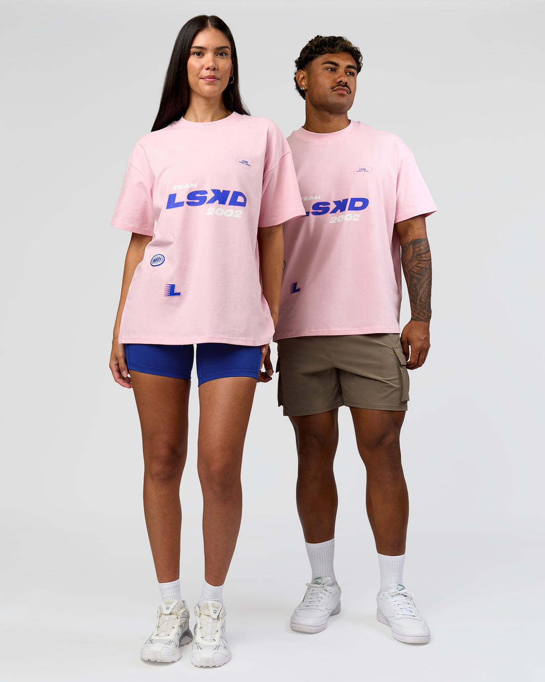 Duo wearing League Heavyweight FLXCotton Oversized Tee - Marshmallow-Power Cobalt | Model:Xav | Size:L | Model:Rhiley | Size:XS