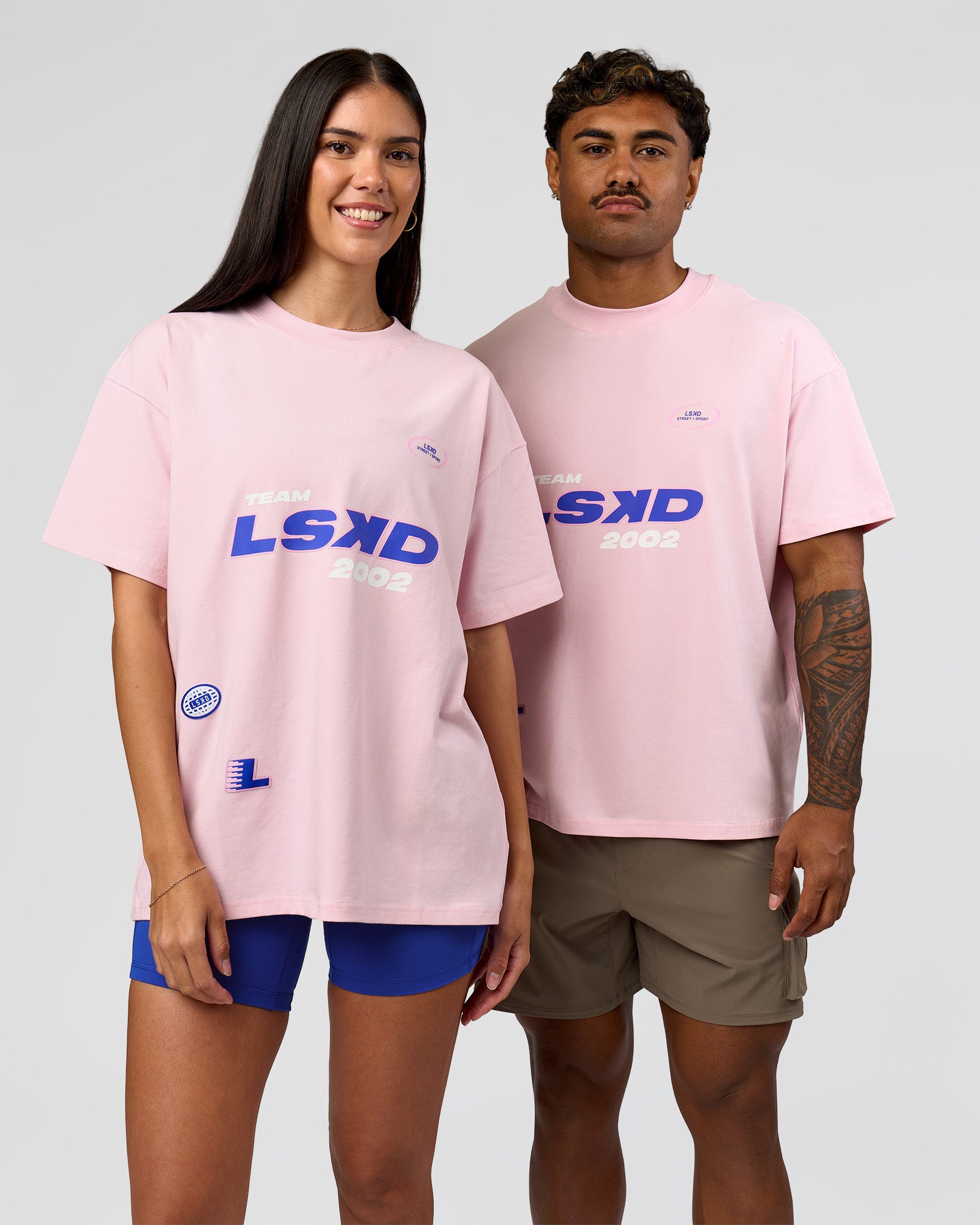 Duo wearing League Heavyweight FLXCotton Oversized Tee - Marshmallow-Power Cobalt | Model:Xav | Size:L | Model:Rhiley | Size:XS