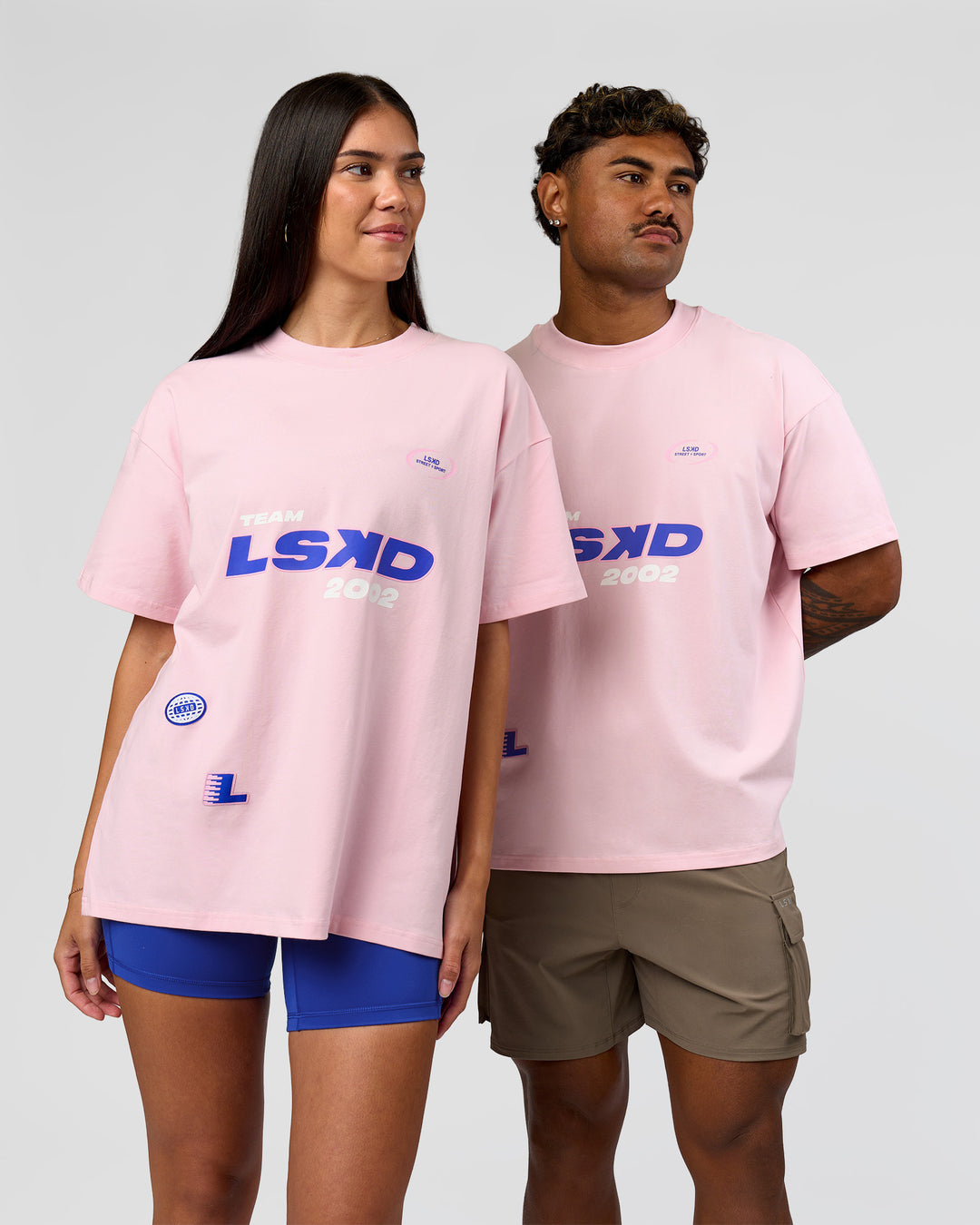 Duo wearing League Heavyweight FLXCotton Oversized Tee - Marshmallow-Power Cobalt | Model:Xav | Size:L | Model:Rhiley | Size:XS