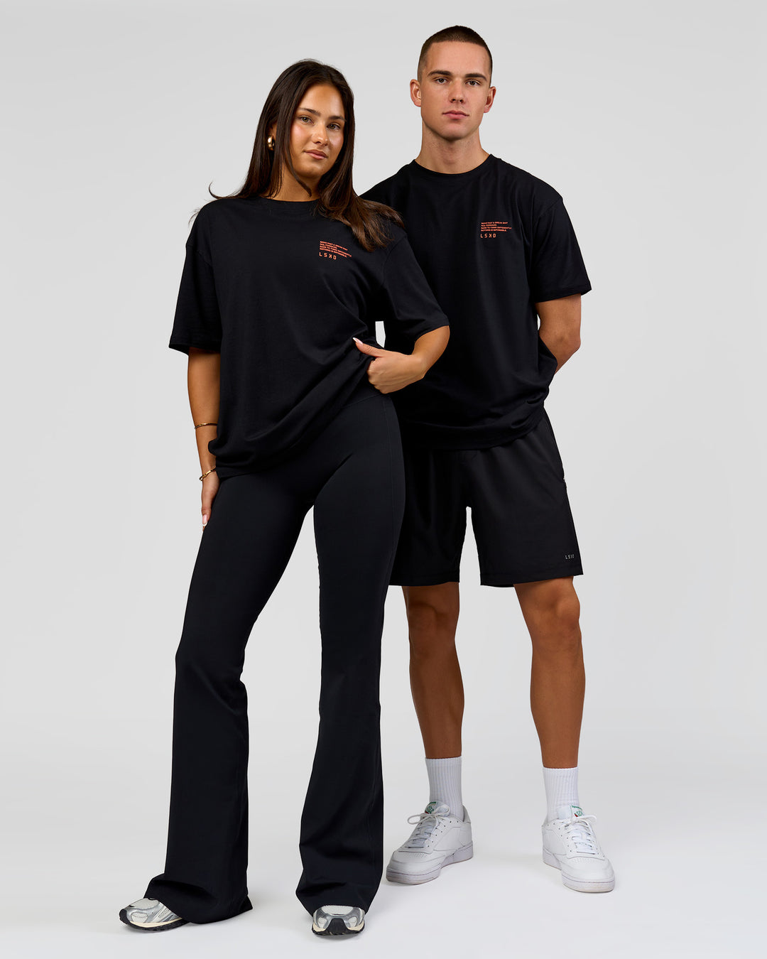 Duo wearing Coffee Run FLXCotton Oversized Tee - Black-Ultra Orange | Model:Albert | Size:M | Model:Bianca | Size:XS - view 5