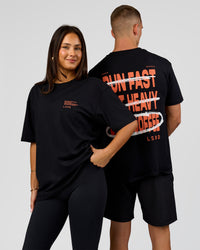 Duo wearing Coffee Run FLXCotton Oversized Tee - Black-Ultra Orange | Model:Albert | Size:M | Model:Bianca | Size:XS | Thumbnail Index: 9