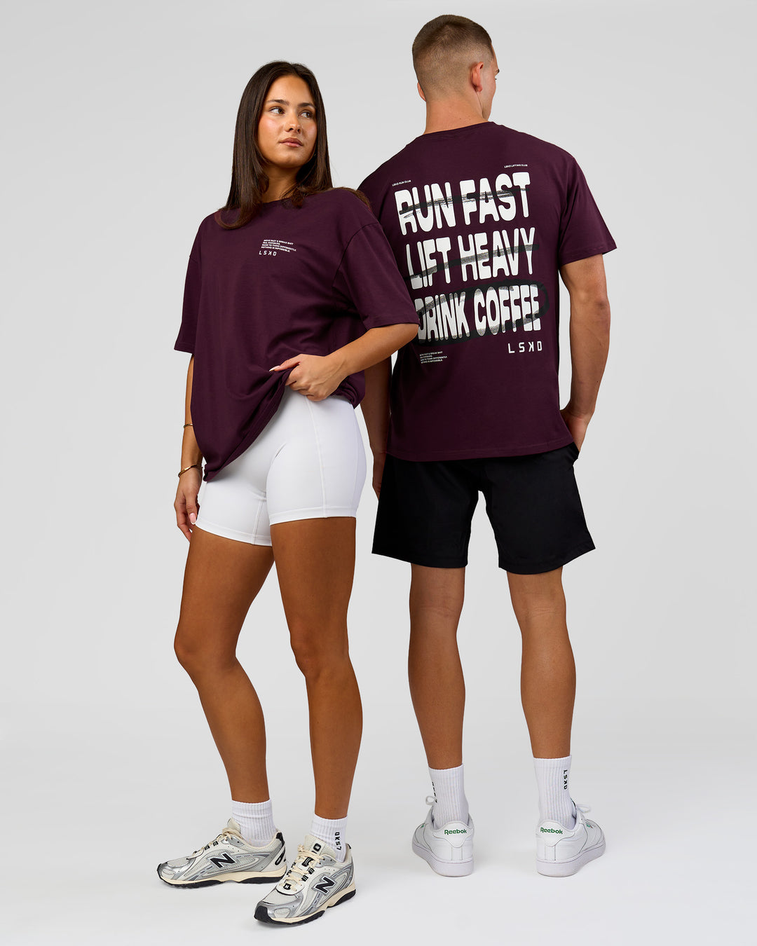 Duo wearing Coffee Run FLXCotton Oversized Tee - Cherry Lacquer-Black | Model:Albert | Size:M | Model:Bianca | Size:XS - view 1