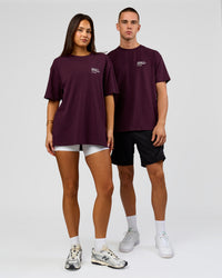 Duo wearing Coffee Run FLXCotton Oversized Tee - Cherry Lacquer-Black | Model:Albert | Size:M | Model:Bianca | Size:XS | Thumbnail Index: 15