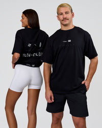 Duo wearing Deadly Runners Run Club FLXCotton Oversize Tee - Black | Model:Bella | Size:S | Model:Jaiden | Size:M | Thumbnail Index: 0