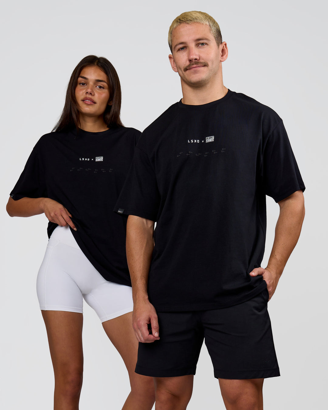 Duo wearing Deadly Runners Run Club FLXCotton Oversize Tee - Black | Model:Bella | Size:S | Model:Jaiden | Size:M - view 5