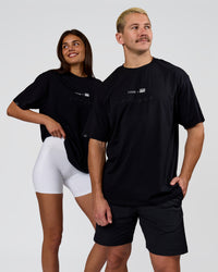 Duo wearing Deadly Runners Run Club FLXCotton Oversize Tee - Black | Model:Bella | Size:S | Model:Jaiden | Size:M | Thumbnail Index: 10