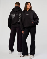 Duo wearing Andrew J. Steel x LSKD Boxy Hoodie - Black | Model:Bianca | Size:S | Model:Jaiden | Size:L | Thumbnail Index: 0