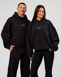 Duo wearing Andrew J. Steel x LSKD Boxy Hoodie - Black | Model:Bianca | Size:S | Model:Jaiden | Size:L | Thumbnail Index: 3