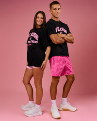 Duo wearing BCAM FLXCotton Graphic Oversized Tee - Black | Model:Bianca | Size:S | Model:Albert | Size:M | Thumbnail Index: 21