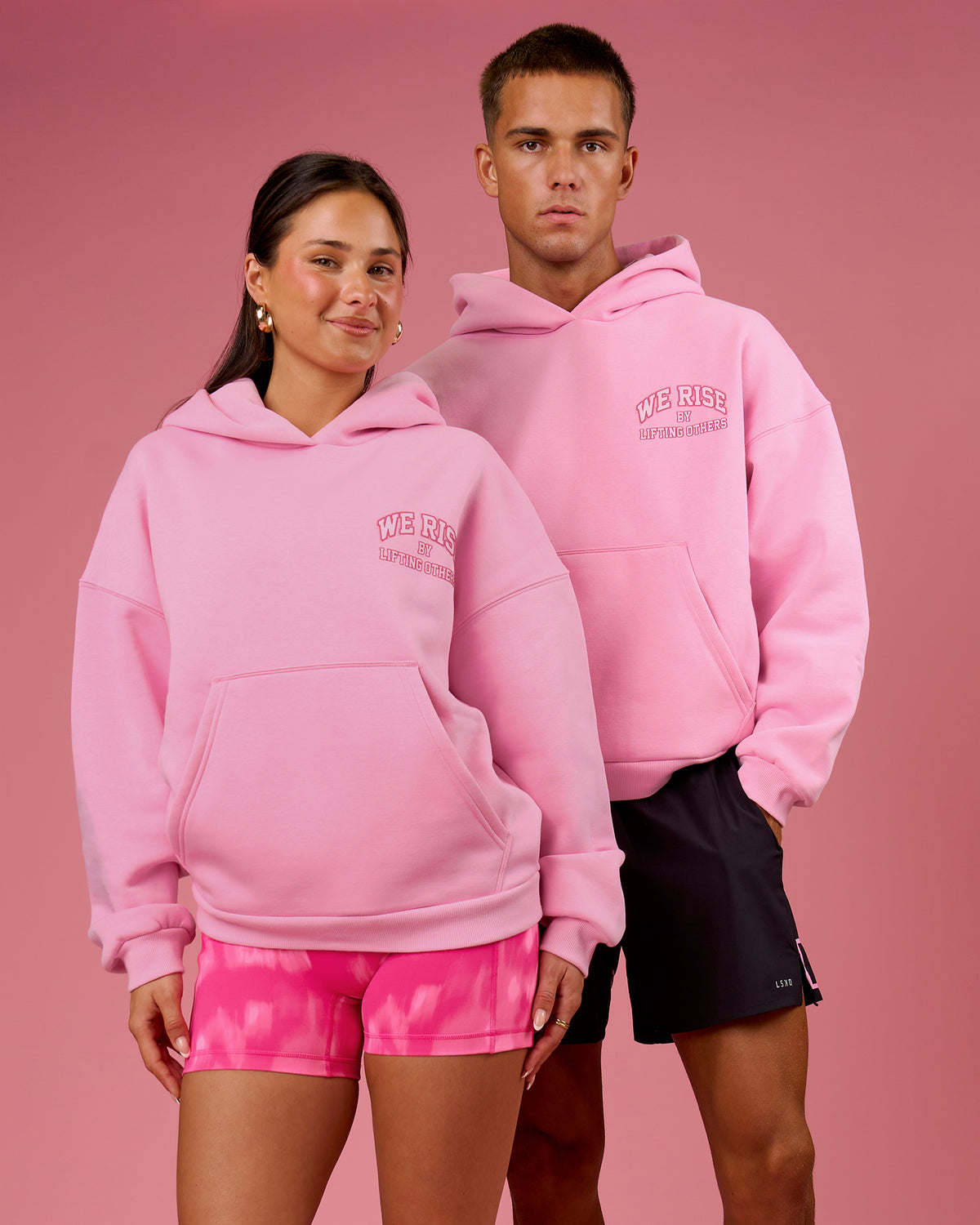 Duo wearing BCAM Heavyweight Boxy Hoodie - Pink Rose | Model:Bianca | Size:S | Model:Albert | Size:M