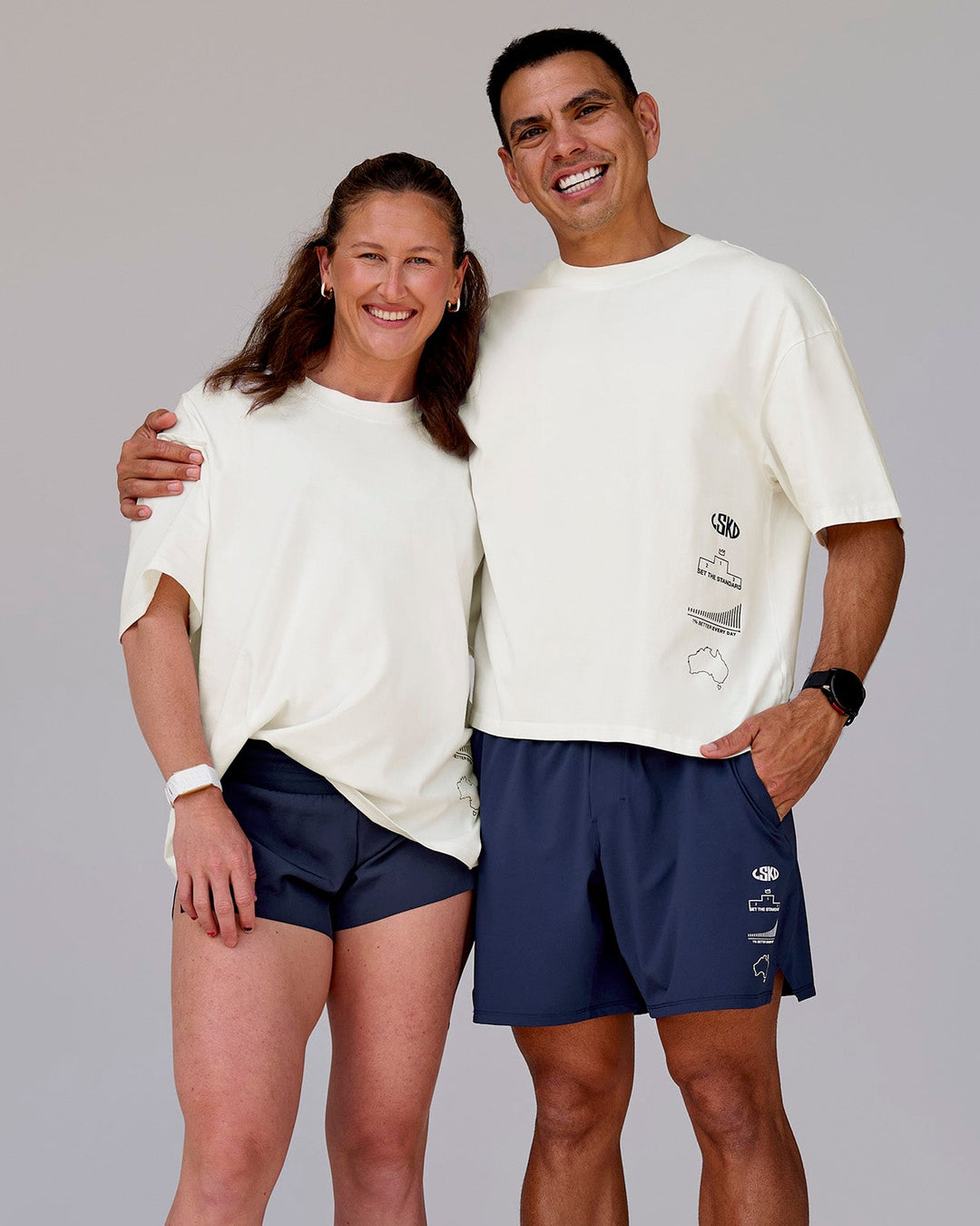 Duo wearing Greatest of All Time Heavyweight FLXCotton Oversized Tee - Off White Washed-Scarlet | Model:Tia | Size:S | Model:Shane | Size:L - view 23
