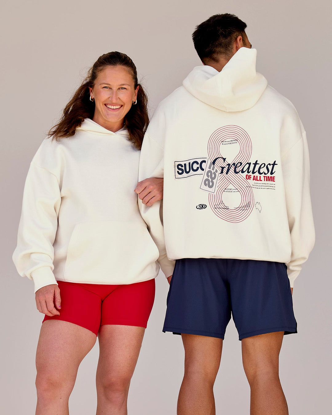 Duo wearing Greatest of All Time Heavyweight Oversized Hoodie - Off White | Model:Tia | Size:S | Model:Shane | Size:L - view 1