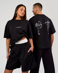 Duo wearing Andrew J. Steel x LSKD Heavyweight Boxed Tee - Black | Model:Bianca | Size:XS | Model:Jaiden | Size:L | Thumbnail Index: 0