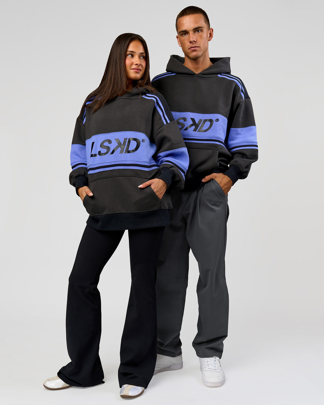 Duo wearing A-Team Oversized Hoodie - Onyx-Bluebell | Model:Bianca | Size:XS | Model:Albert | Size:M - view 2