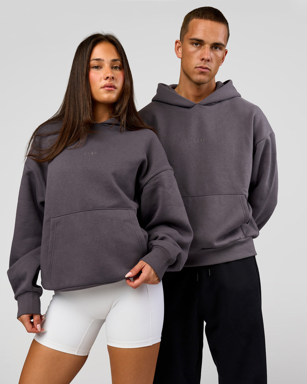 Duo wearing Base Oversized Hoodie - Duskstone | Model:Bianca | Size:XS | Model:Albert | Size:M - view 1