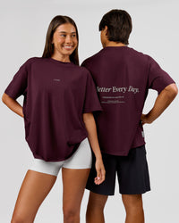 Duo wearing VS26 1% Better FLXCotton Oversize Tee - Cherry Lacquer-Off White | Model:Charli | Size:XS | Model:George | Size:M | Thumbnail Index: 0