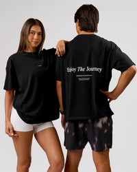 Duo wearing VS26 Journey FLXCotton Oversize Tee - Black-White | Model:Charli | Size:XS | Model:George | Size:M | Thumbnail Index: 0