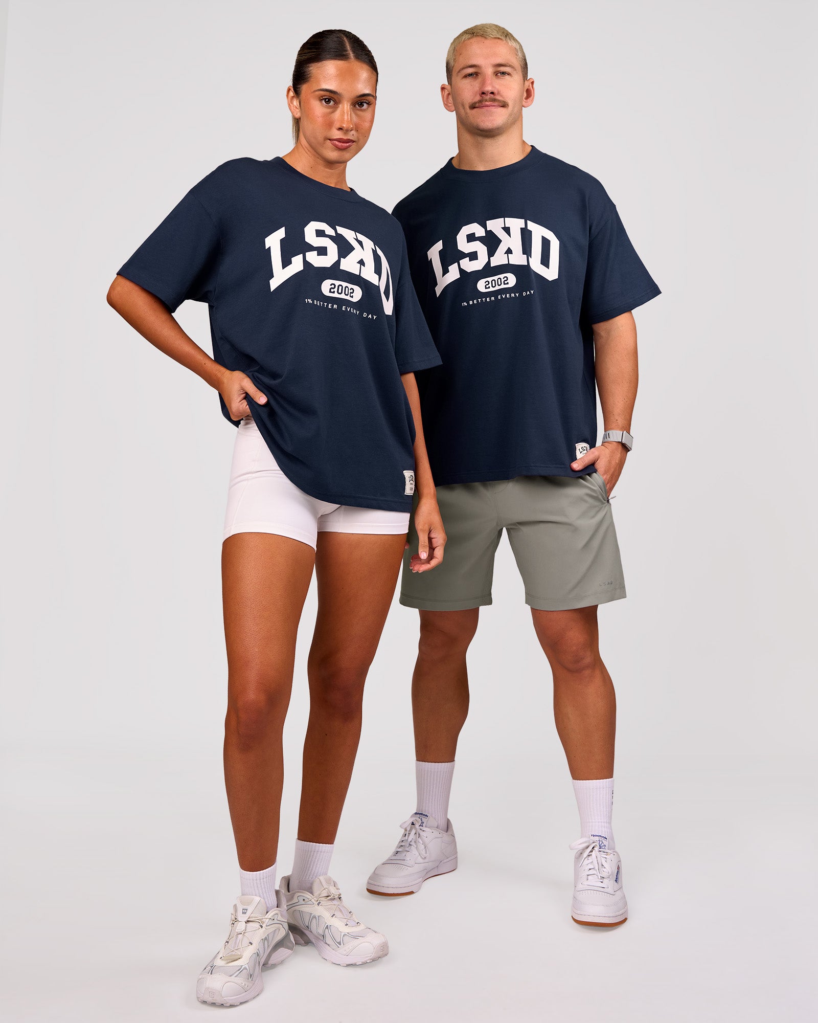 Duo wearing Varsity EST Heavyweight Oversized Tee  - Future Navy-White | Model:Charli | Size:XS | Model:Jaiden | Size:M