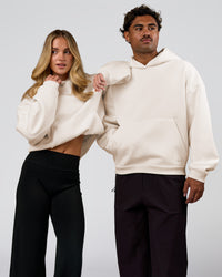 Duo wearing Tonal Legacy Boxy Hoodie - Off White-Off White | Model:Issy | Size:XS | Model:Xav | Size:L | Thumbnail Index: 3