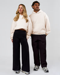Duo wearing Tonal Legacy Boxy Hoodie - Off White-Off White | Model:Issy | Size:XS | Model:Xav | Size:L | Thumbnail Index: 6