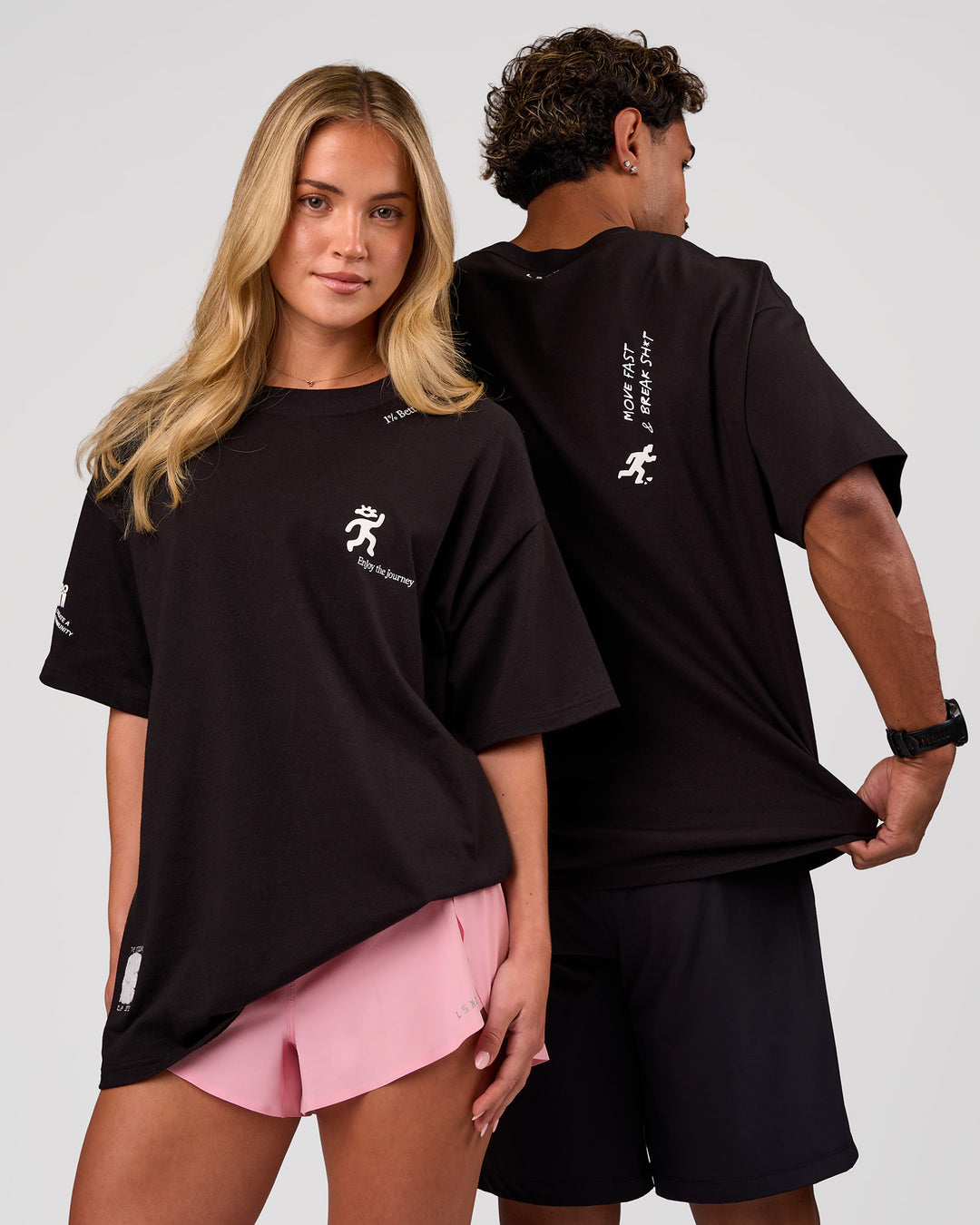 Duo wearing Values Manifesto Heavyweight Oversized Tee  - Black-White | Model:Issy | Size:XS | Model:Xav | Size:L - view 1