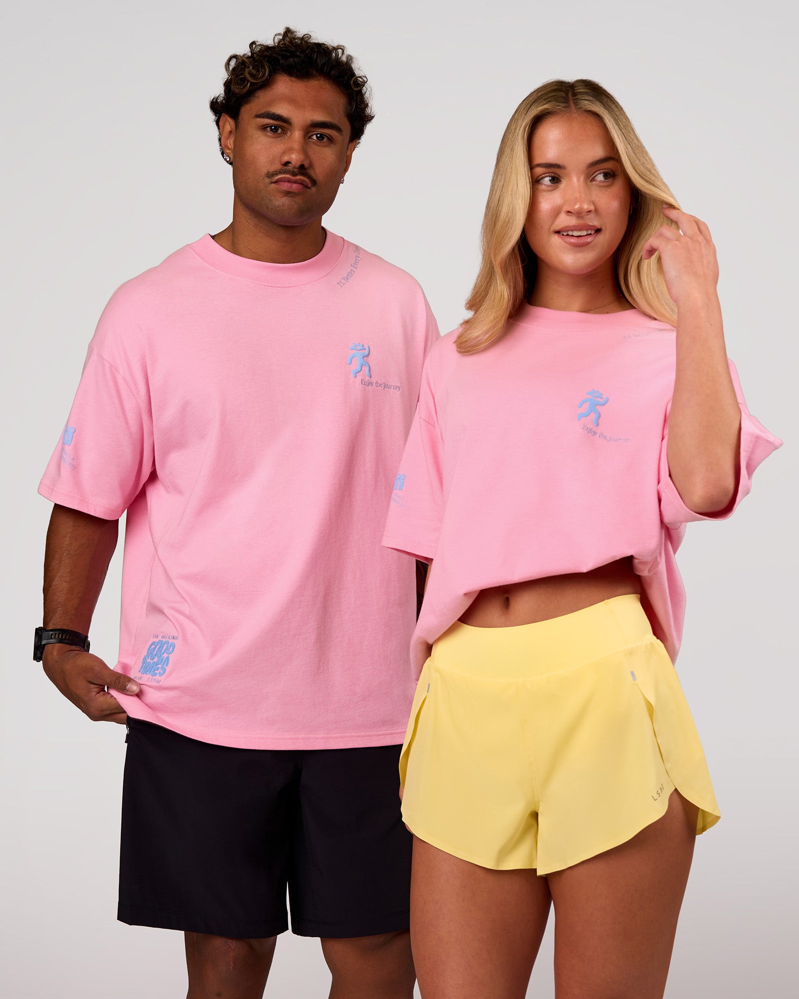 Duo wearing Values Manifesto Heavyweight Oversized Tee  - Pink Rose-Open Air | Model:Issy | Size:XS | Model:Xav | Size:L