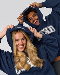 Duo wearing Varsity Boxy Hoodie - Future Navy-White | Model:Issy | Size:XS | Model:Xav | Size:L | Thumbnail Index: 11