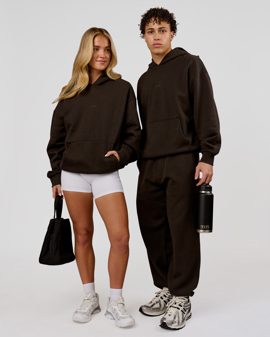 Duo wearing Base Oversized Hoodie - Ground Coffee | Model:Issy | Size:XS | Model:Leandro | Size:M - view 4