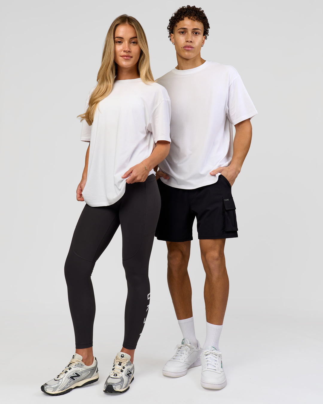 Duo wearing Benchmark FLXCotton Oversized Tee - White-Pale Lilac | Model:Issy | Size:XS | Model:Leandro | Size:M - view 10
